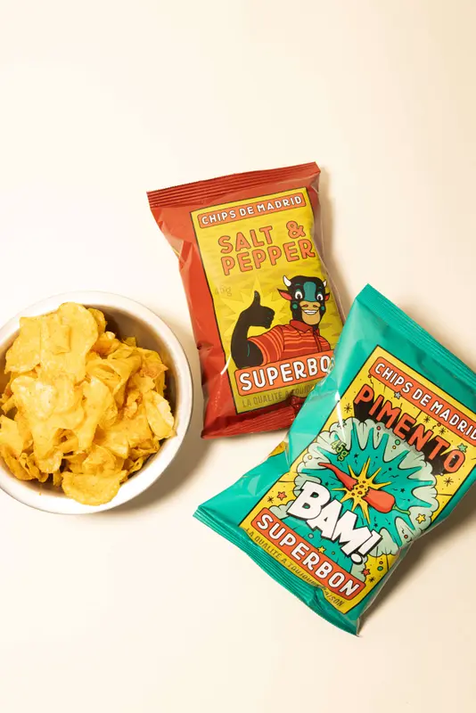 Superbon Chips de Madrid salt & pepper and pimento flavors with a bowl of golden potato chips
